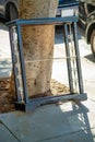 Furniture or book shelf in front of house on move day or to be removed as trash for disposal leaning against oak tree on Royalty Free Stock Photo