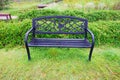 Furniture chairs on the lawn in the park, Covered with trees, Royalty Free Stock Photo