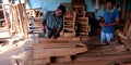 Furniture making process going on at workshop by indian artist