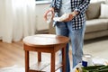 woman degreasing old table surface with solvent Royalty Free Stock Photo