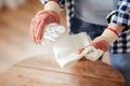 woman degreasing old table surface with solvent Royalty Free Stock Photo