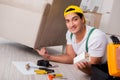 The furniture repairman repairing armchair at home Royalty Free Stock Photo