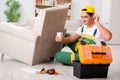 The furniture repairman repairing armchair at home Royalty Free Stock Photo