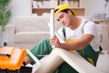 The furniture repairman repairing armchair at home Royalty Free Stock Photo