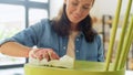 woman applying solvent to rag at home