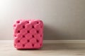 Furniture in the room. Pink pouf with decoration buttons in the Royalty Free Stock Photo