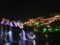 Furong Ancient Town illuminated at night.