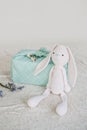 Furoshiki Japanese Gift fabric Wrapping and knitted toy rabbit. Zero waste, eco-friendly gift wrapping box. Fall hand