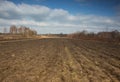 Furrows plowed field early in spring