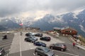 Parking lot with cars, mountain panorama and alpine hut EdelweiÃhÃ¼tte on EdelweiÃspitze