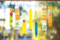 fused glass wind chimes in various colors, outdoors in sunlight Royalty Free Stock Photo