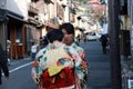 Two woman in Kimono dress on the way to Fushimi Inari Shrine. Royalty Free Stock Photo