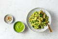 Fusilli with green pesto sauce