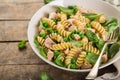 Fusilli pasta with salmon, spinach and grean peas