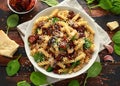 Fusilli Pasta with sun dried tomatoes, mushrooms, parmesan cheese and spinach. healthy food. Royalty Free Stock Photo