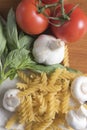 Fusilli pasta with tomatoes, basil and garlic Royalty Free Stock Photo