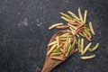 Fusilli pugliesi. Italian twisted pasta on wooden spoon. Top view Royalty Free Stock Photo