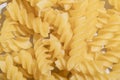Fusilli Spiral Dry Raw Pasta Background Fusilli pasta italian spiral pattern texture background Traditional italian food Royalty Free Stock Photo