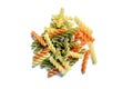 Fusilli tricolore pasta isolated on a white background. Heap of uncooked pasta Royalty Free Stock Photo