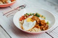 Fusion food Rice bowl toppings kimchi pork, organic fried egg, Korean eggplant and salad Royalty Free Stock Photo