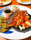 Fusion japanese food-mackerel fish steak soy sauce, Grilled fish with white sesame seed topping and vegetables side dish Royalty Free Stock Photo