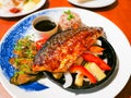 Fusion japanese food-mackerel fish steak soy sauce, Grilled fish with white sesame seed topping and vegetables side dish bell Royalty Free Stock Photo