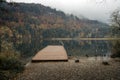 Fussen, Bavaria, Germany. Alpine Lake Schwansee near Hohenschwangau Castle and Neuschwanstein Castle. Cloudy autumn with rain. Au Royalty Free Stock Photo