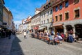 People in street at Fussen with typical bavarian architecture buildings in day light at 27 March