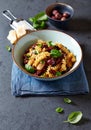 Fussili pasta with olives, capers, dried tomatoes and parmesan