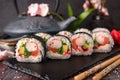 Futomaki with salmon, royal prawn, avocado, chuka, tobacca and cream cheese Philadelphia Royalty Free Stock Photo