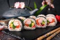 Futomaki with salmon, royal prawn, avocado, chuka, tobacca and cream cheese Philadelphia Sushi menu. Royalty Free Stock Photo