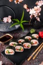 Futomaki with salmon, royal prawn, avocado, chuka, tobacca and cream cheese Philadelphia Sushi menu. Royalty Free Stock Photo
