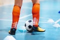 Futsal league. Indoor soccer player in futsal shoes training dribble drill with ball. Indoor soccer training Royalty Free Stock Photo