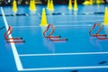Futsal training field with yellow cones and red hurdles