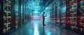 Future of Big Data Center Chief Technology Officer using laptop in warehouse, streaming digitalization lines through Royalty Free Stock Photo