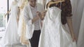 Future bride customer talking with wedding store shopkeeper Royalty Free Stock Photo