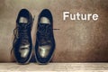 Future on brown board and work shoes on wooden floor