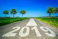 Future and destination concept - road marking in form of 2019 year and arrow Royalty Free Stock Photo