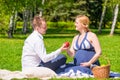 Future father gives his pregnant wife apple resting