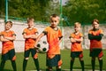 Future football champions. Little boys, kids in sports uniform posing with ball at soccer school stadium. Concept of Royalty Free Stock Photo