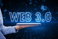 Future of the Internet, blockchain, computing and meta concept with glowing web 3.0 sign above human hand with digital tablet on Royalty Free Stock Photo