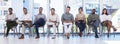 Future leaders. Shot of a group of people waiting to be interviewed for a job at a modern office.