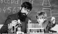 The Future of Memory. father and son at school. Back to school. Explaining biology to child. Chemistry and physics