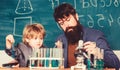 The Future of Memory. father and son at school. Back to school. Explaining biology to child. Chemistry and physics