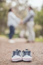 Future mom and dad with little baby shoes Royalty Free Stock Photo