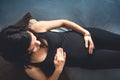 Future mother laying on bed, maternity shooting concept. Happy pregnant woman holding belly Royalty Free Stock Photo