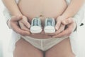 Future mum and dad holding baby shoes Royalty Free Stock Photo