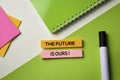 The Future is Ours! text on top view office desk table of Business workplace and business objects