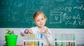 Future scientist. Explore and investigate. School lesson. Girl cute school pupil play with test tubes and colorful Royalty Free Stock Photo