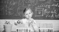 Future scientist. Explore and investigate. School lesson. Girl cute school pupil play with test tubes and colorful Royalty Free Stock Photo